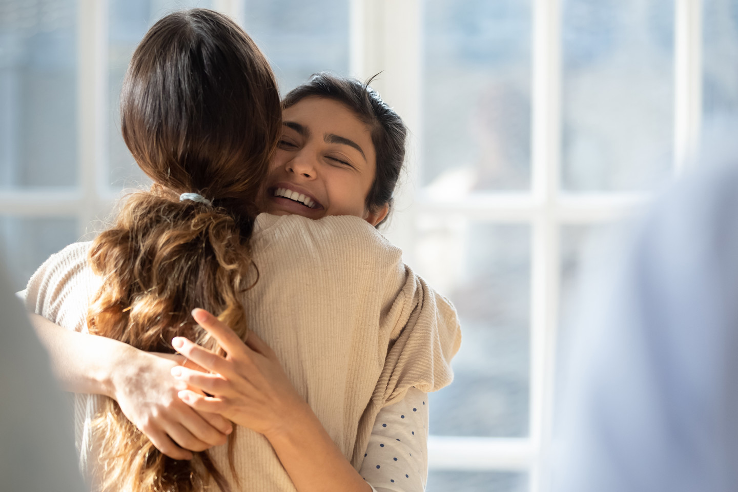 Corcentric two women hugging